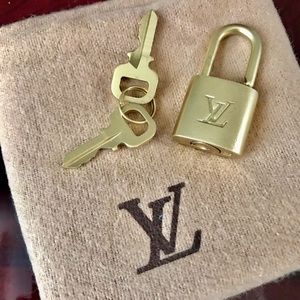 Authentic Louis Vuitton padlock and  2 keys number #311 like new